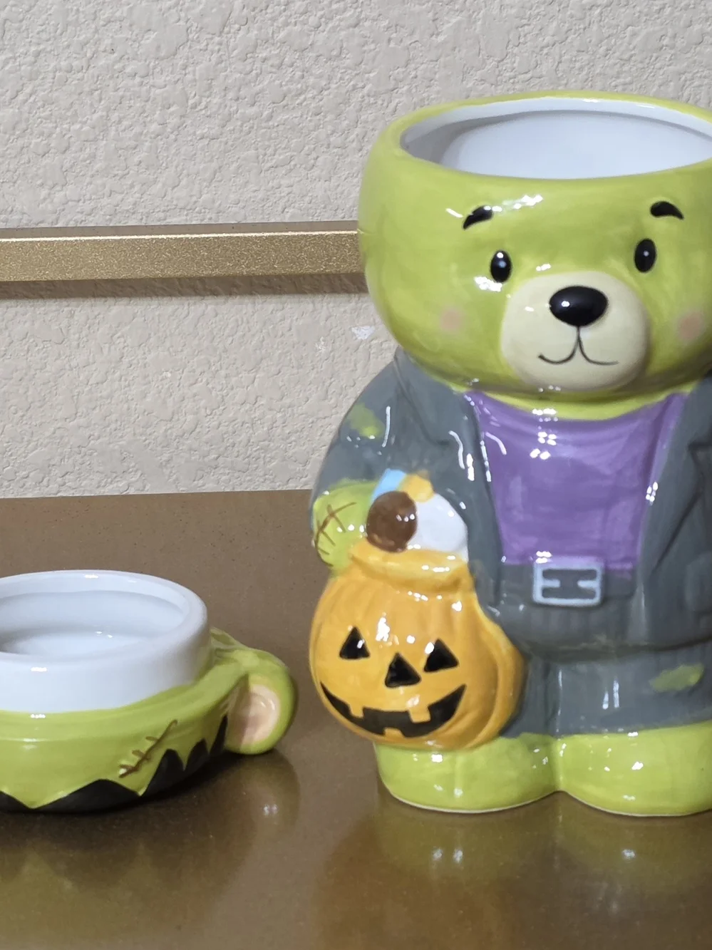 Frankenstein Bear Halloween Mug with Lid Holding A Jack-o-lantern